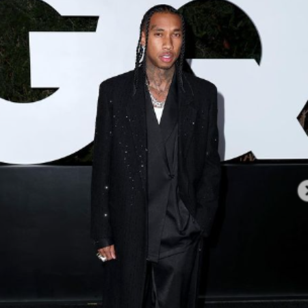 Tyga captivates in a stunning photo shoot, clad in an alluring ebony gown.